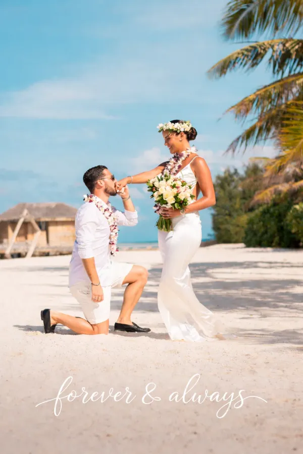 Couple swimming underwater photography in the Maldives